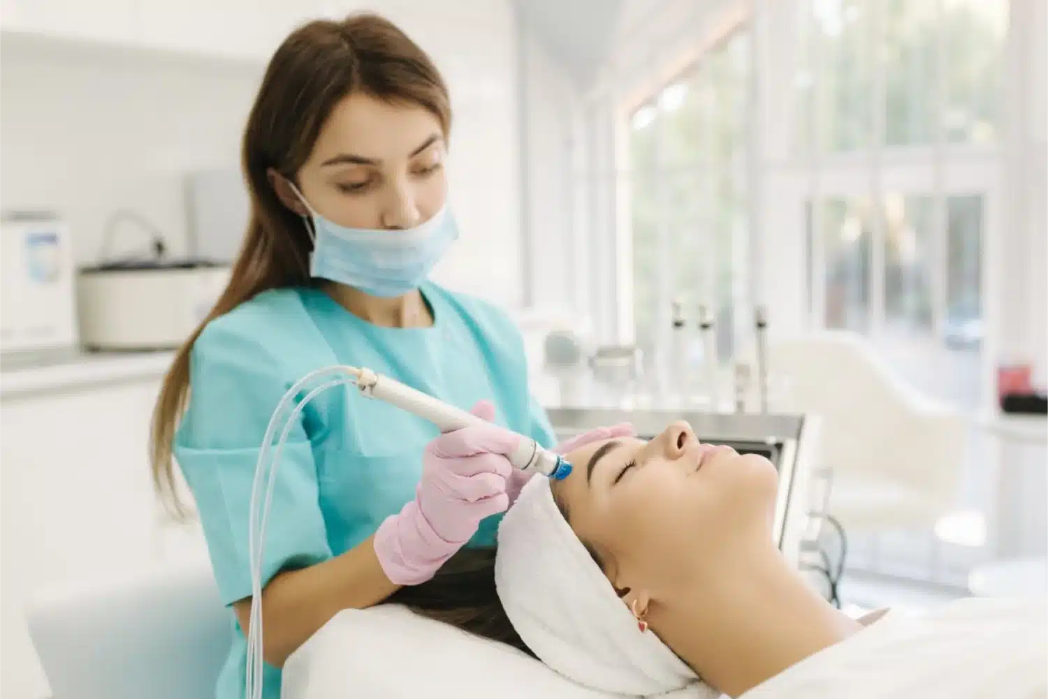 Professional female cosmetologist doing hydrafacial content image